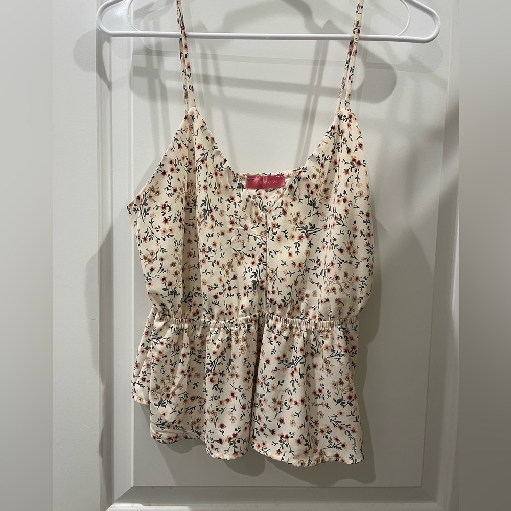 Floral peplum style shirt. Great for spring or autumn.